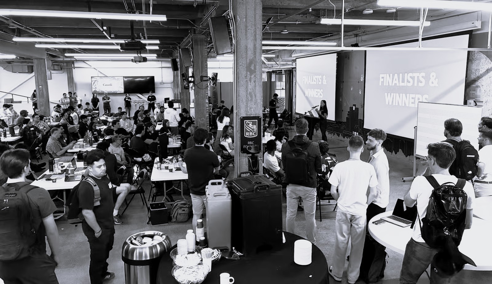 Students presenting hackathon results on stage