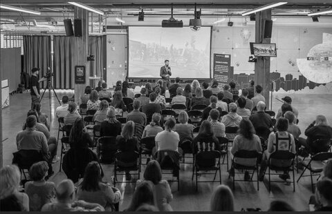 A panel discussion in front of an audience