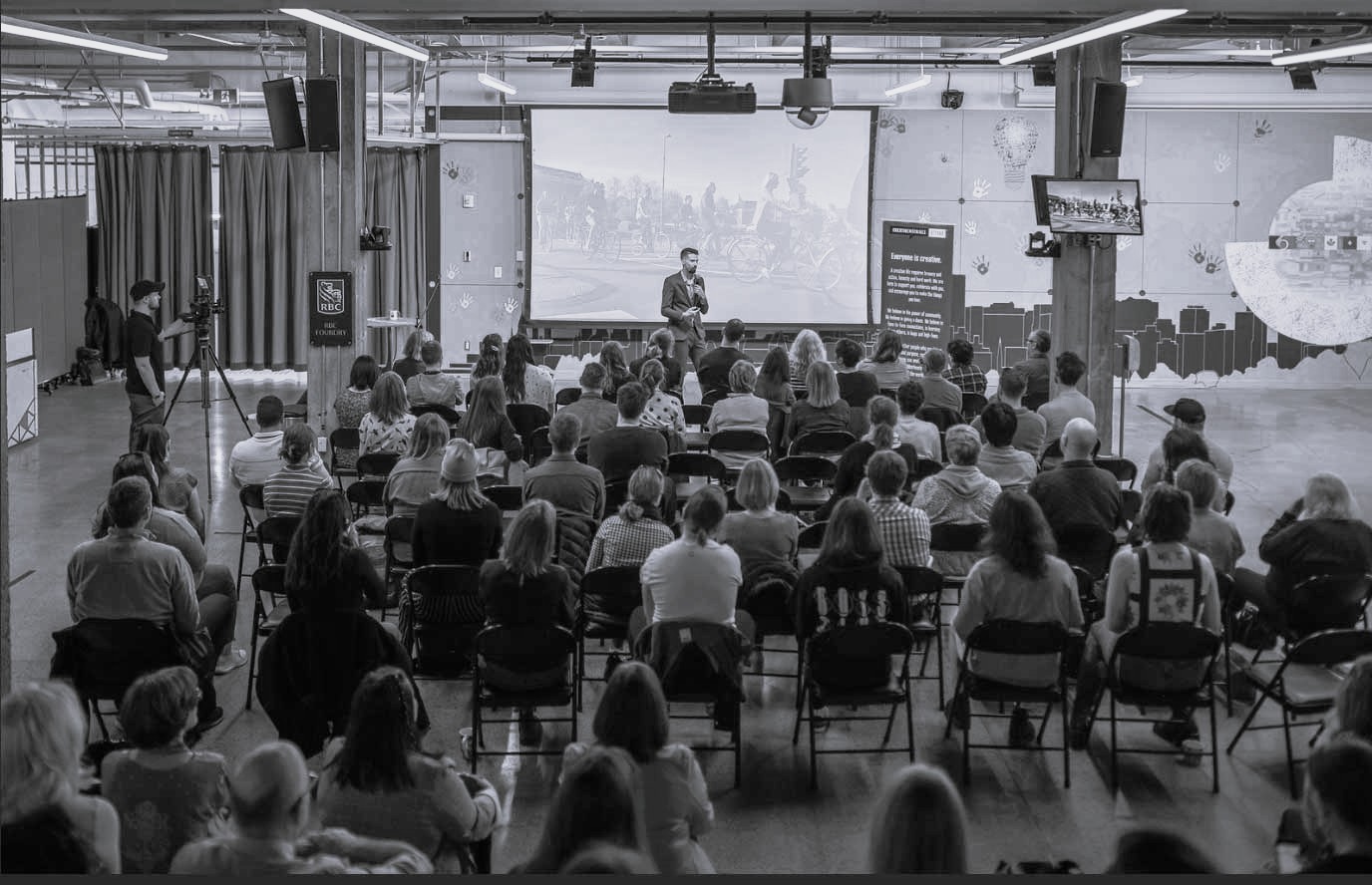 A panel discussion in front of an audience